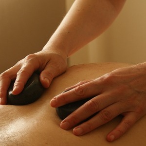 Ease Your Sore Muscles With a Hot Stone Massage